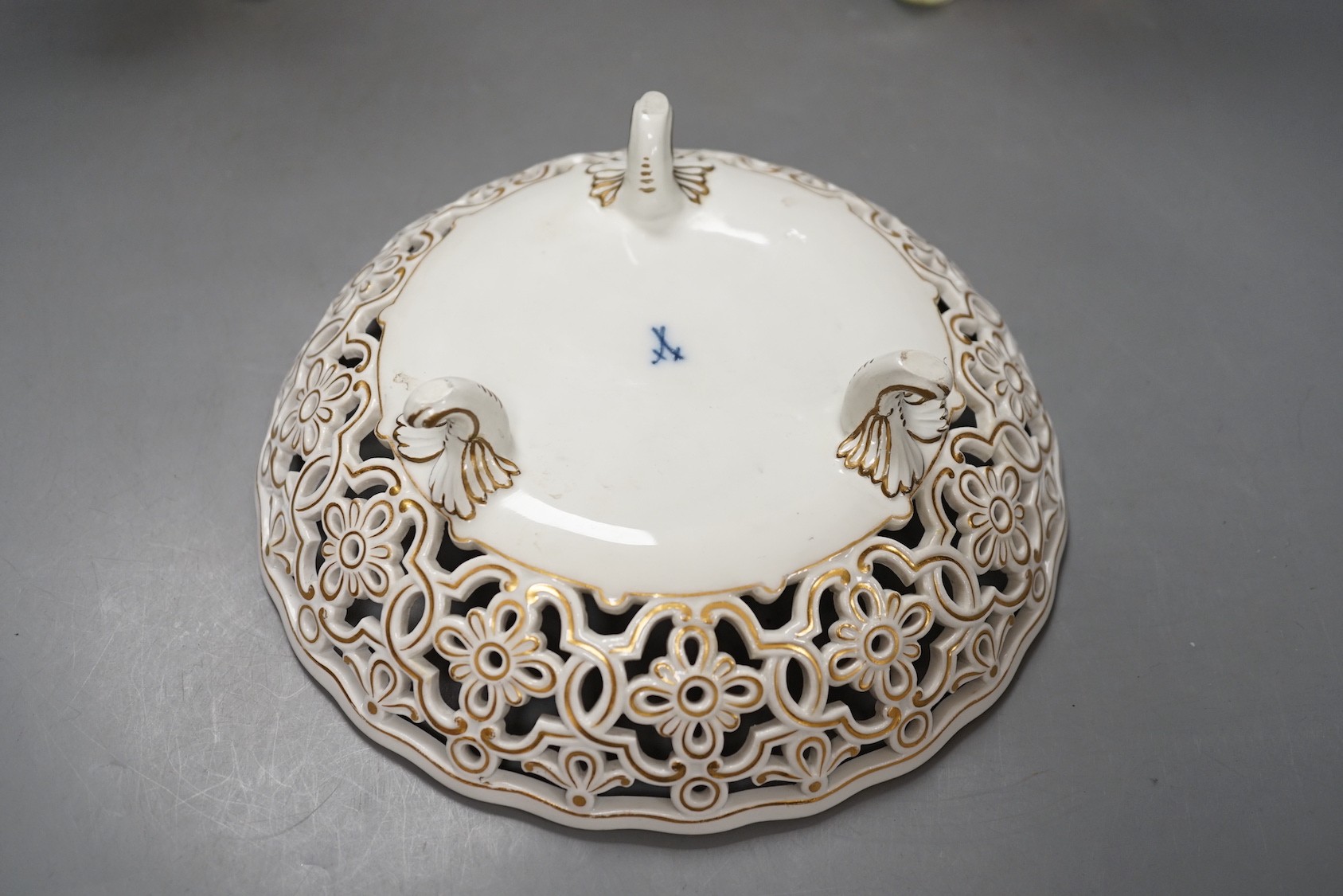 A Meissen flower painted pierced dish and two German porcelain candlesticks - 25.5cm tall